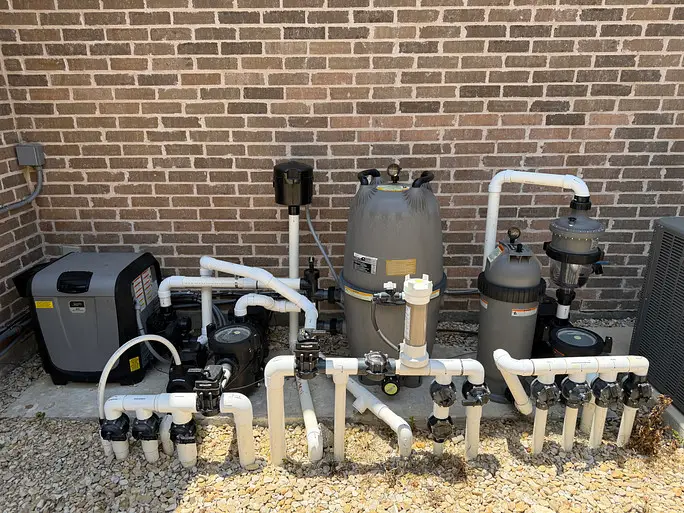Pool pump and filter on an equipment pad after installation