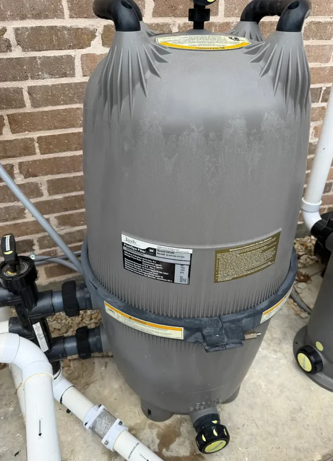 Cartridge pool filter installed on an equipment pad